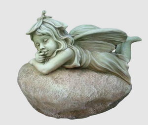 FAIRY LAYING ON ROCK 